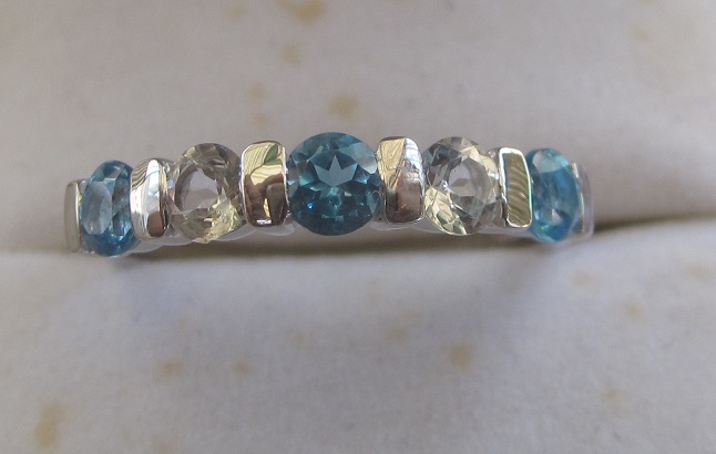 Gold Ring With swiss blue and white topaz.