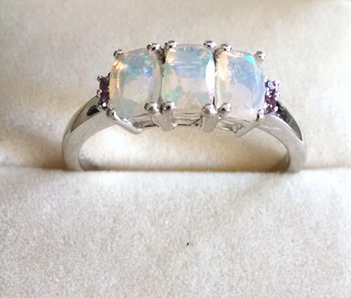 Opal cushion trilogy ring