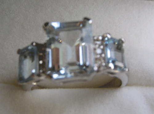 Ring with 3 aqua Oct. cut and diamond