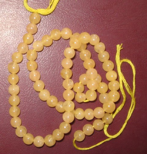 Yellow jade plain round beads.